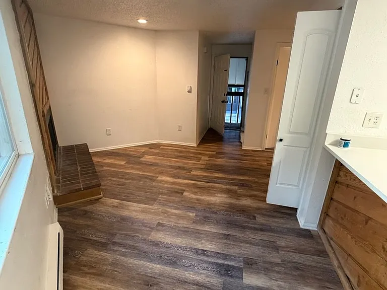 Real wood fireplace on left.