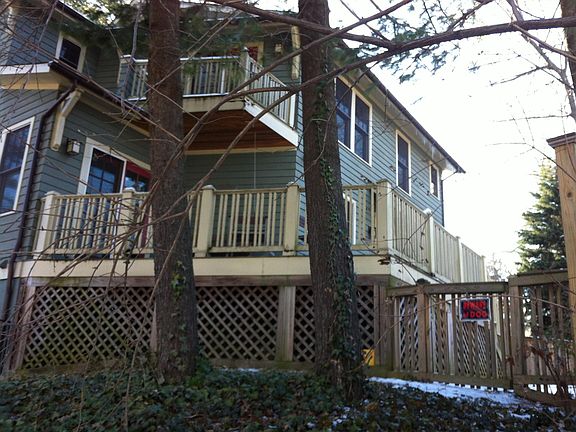 Back side view. Large deck w/small fenced in back yard.