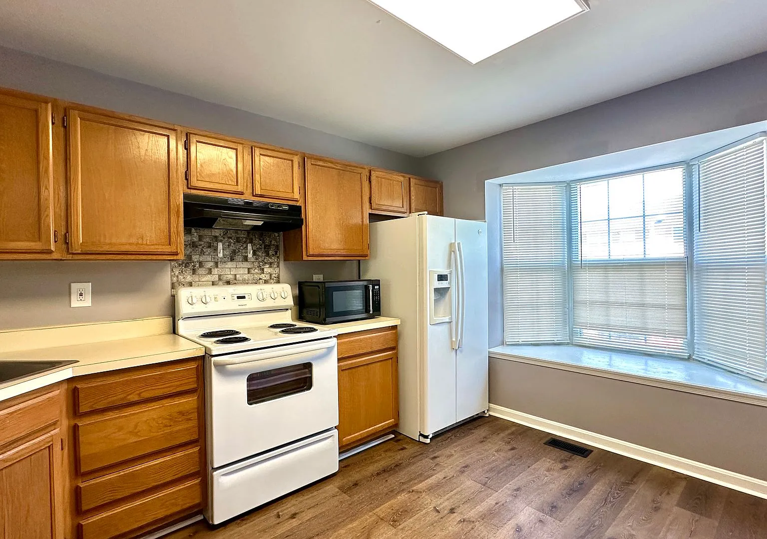 Updated 3-Bedroom Townhome with Finished Walkout Basement, Fenced Yard & Deck — Photo 3