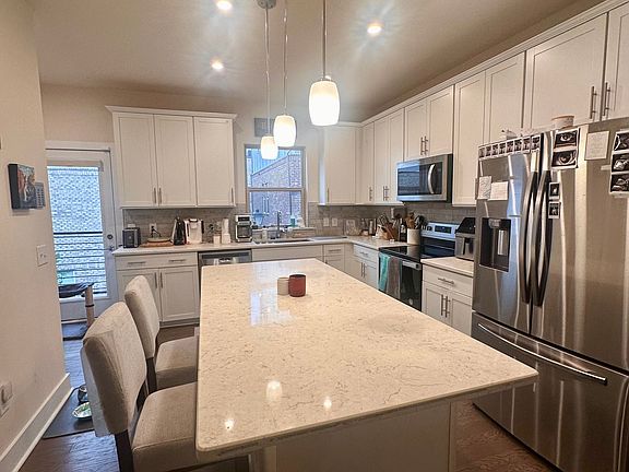 Kitchen - fridge, oven, dishwasher and pantry closet to the left out of picture