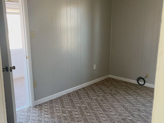 Bedroom/office with a big walk in closet with big windows