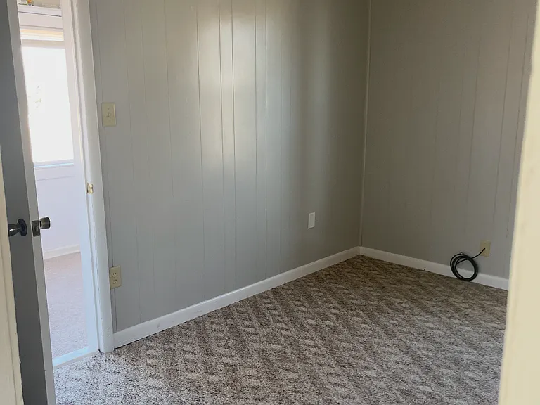 Bedroom/office with a big walk in closet with big windows