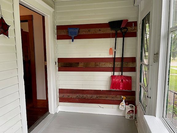The screen door on the right are the front steps. Door on the left enters into the main tv room.