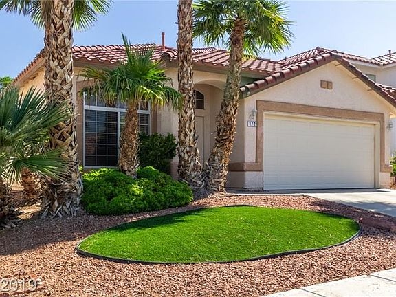 Low maintenance landscape with a combination of desert and synthetic grass