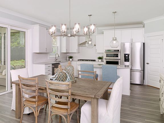 Spacious and inviting Dining Area with elegant engineered wood flooring
