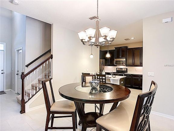 Dining area lookin g to the kitchen and entrance.