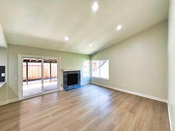 Spacious family room with fireplace and recessed lighting!