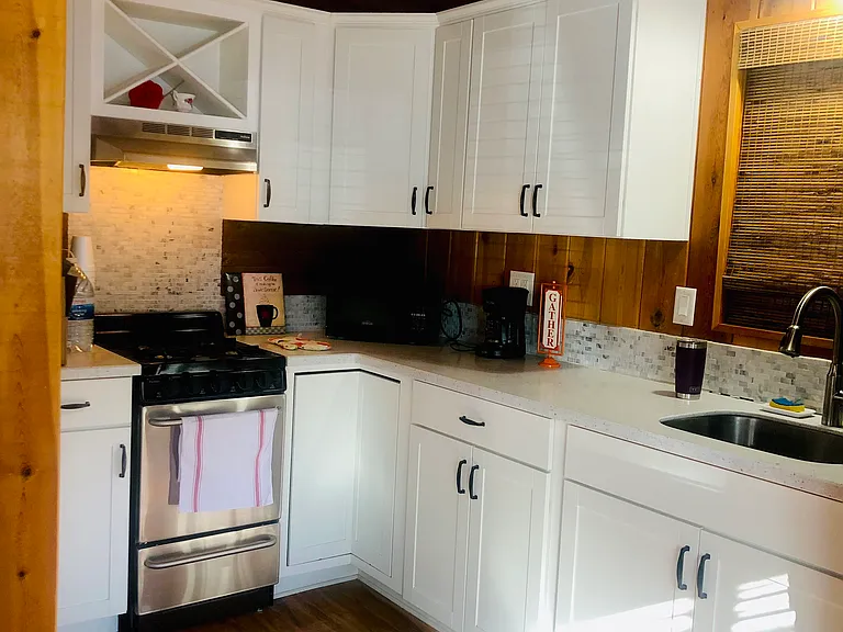 Clean and spacious kitchen. Newly built kitchen cabinets. Lots of cupboard space. Has Stove/Oven/Fridge and Microwave.