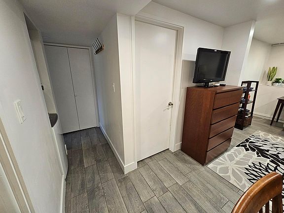 Living/hallway to bathroom/locked door to Main house.
