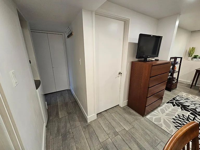 Living/hallway to bathroom/locked door to Main house.