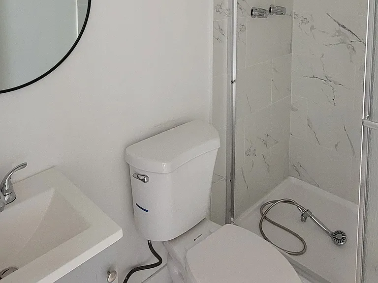 Second bathroom with shower in 2-bedroom apartment at the Hardison Apartments in Pasadena, California.