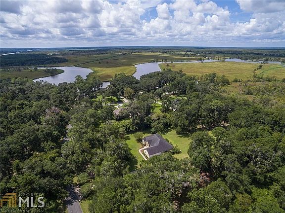 View of Home and River.  This is Cathead River, a deep water river that flows to the Intercoastal Waterway.  This home is on a high bluff and doesn't require Flood Insurance.