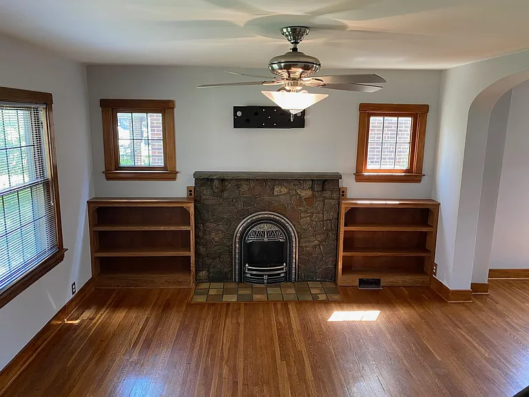 Bookcases on each side of fireplace