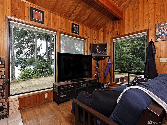 Living room with that terrific view and a nice little woodstove for those chilly winter evenings... check out these HUGE windows!