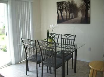 Dining area and slider door to back yard patio area.