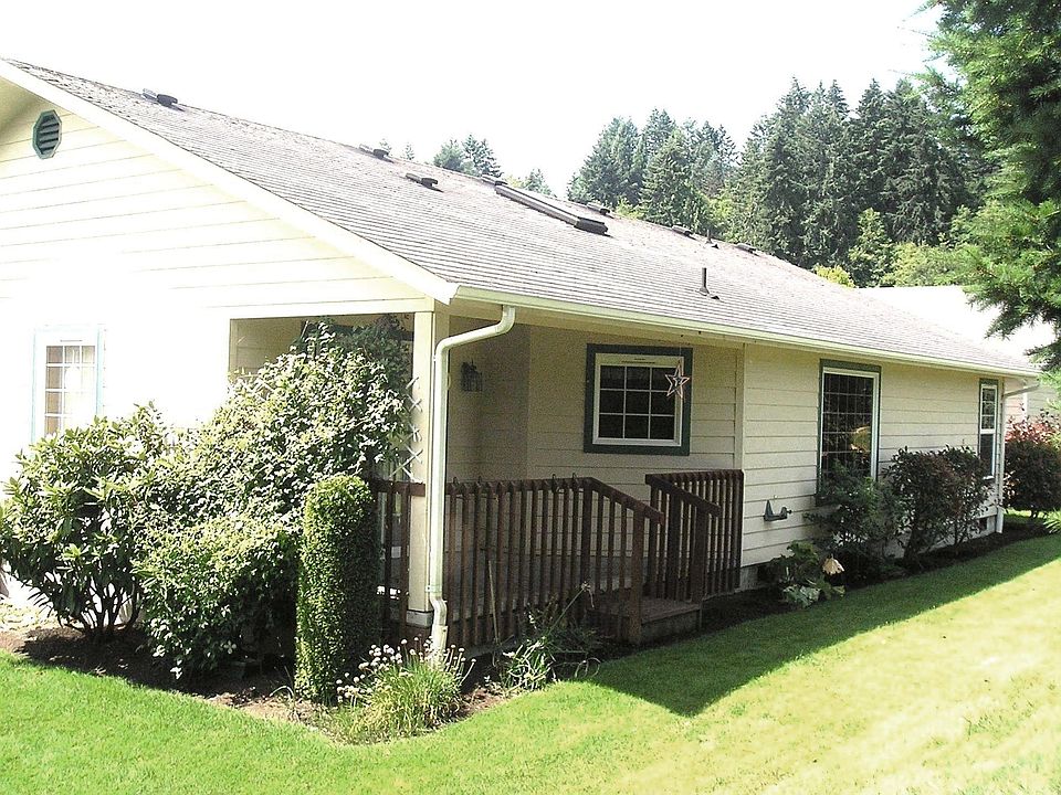 Back of house with covered deck