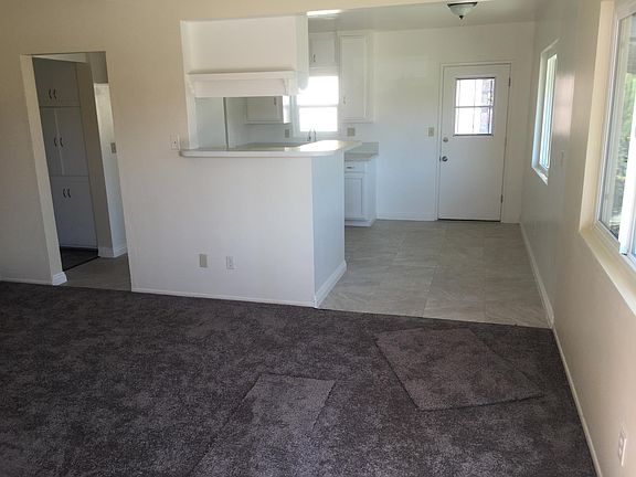 Living & Kitchen. New carpet and fresh coat of paint.