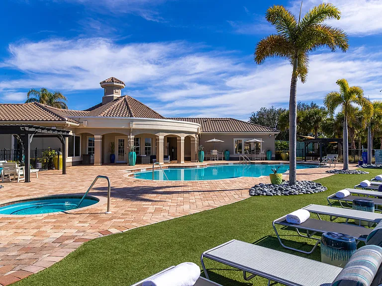 Lounge by the resort-style pool, soak in the spa, and enjoy lush tropical surroundings.
