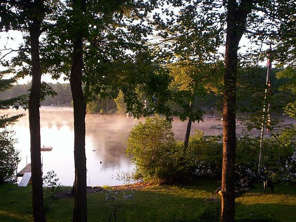 mist rising from the water just after sunrise