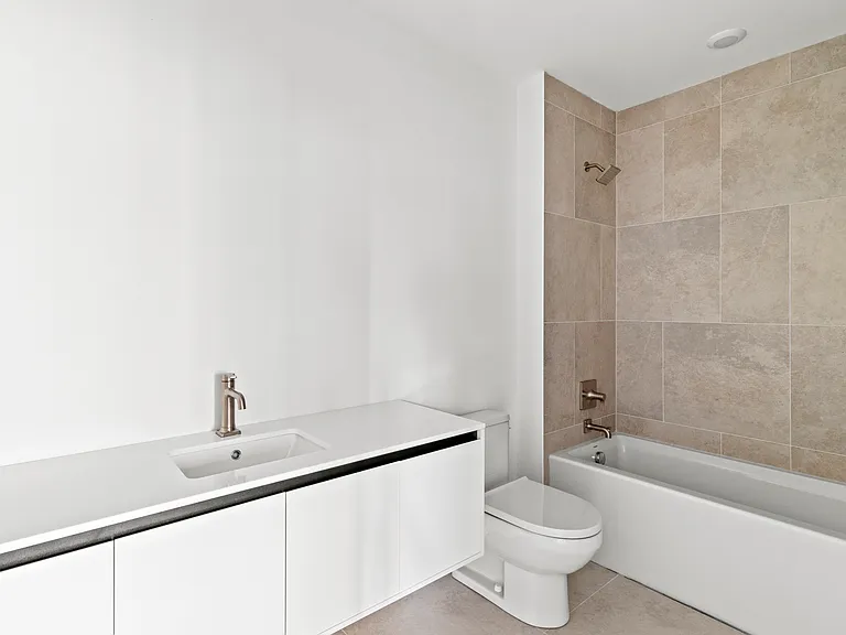 full bathroom (mirror and light fixtures have since been installed)
*photo of similar unit, exact finishes and layouts may vary*