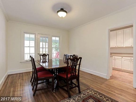 Dining room view as you walk from front door/living area. Rear door leads to outdoor deck. Not shown: modern chandelier.