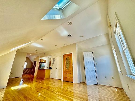 gleaming hardwoods, vaulted ceilings + skylights!