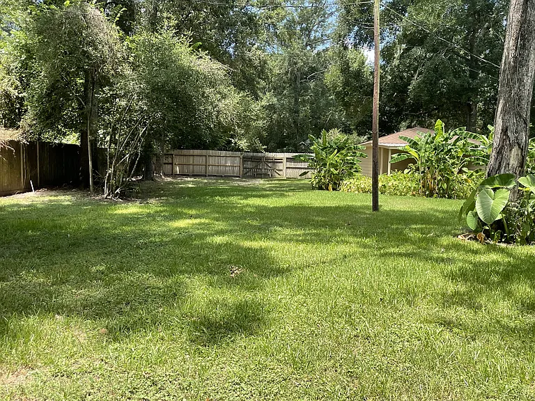 Backyard with full size gate access for campers, etc.