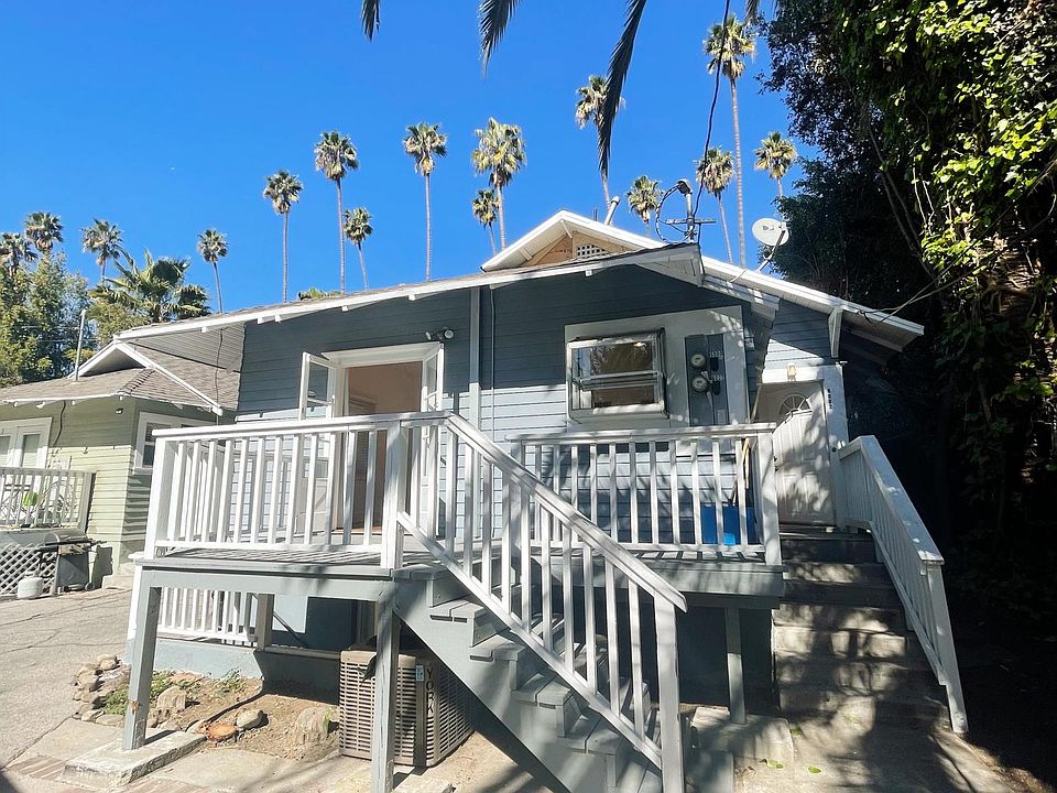 Private back unit on a palm tree lined street __