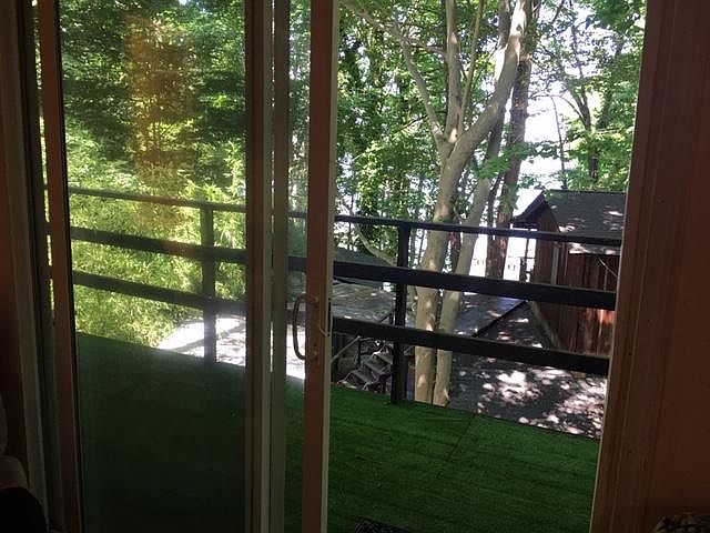 THIS IS LOOKING DOWN FROM THE DECK TOWARD THE LAKE.