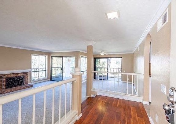 Formal entry, brick fireplace.