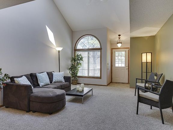Sunny living room flooded with natural light from two skylights and front windows