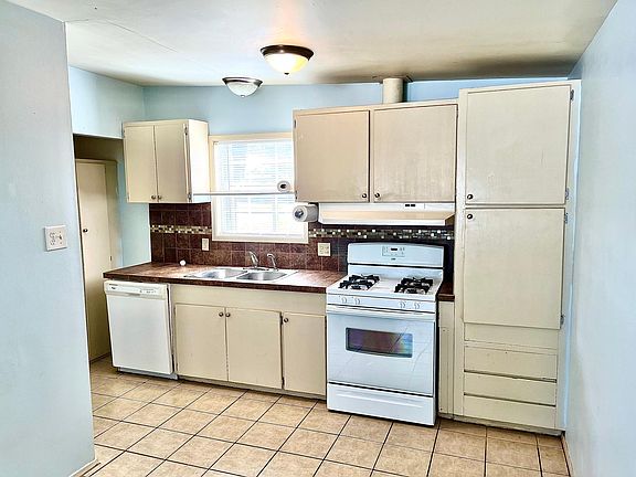 Open kitchen with window viewing front yard