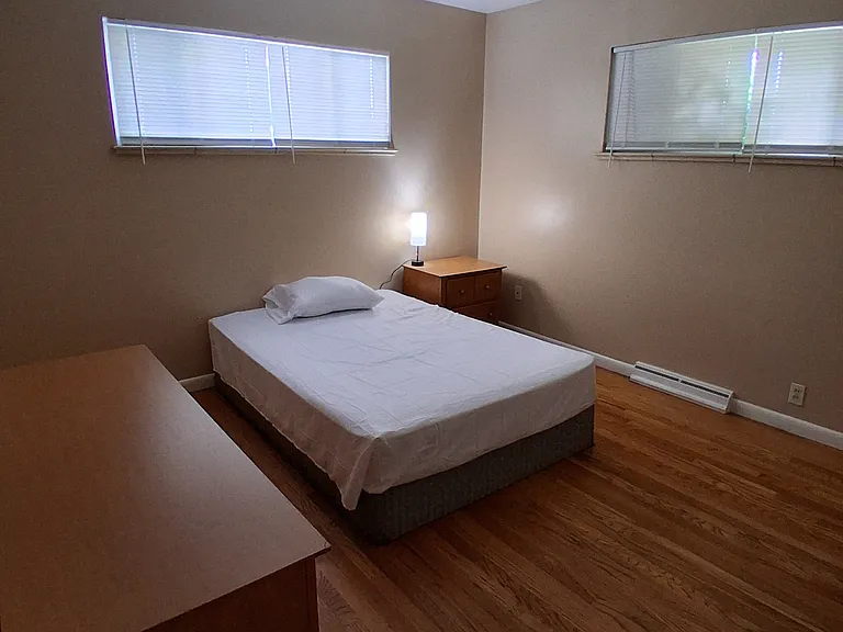 Room 5 is 141.16sqft with full-size bed, dresser, end table and lamp.