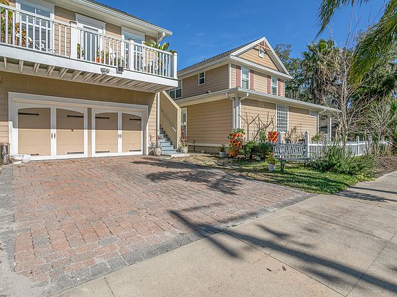 Cottage is completely separate from main house. Garage below does not have cars in it. Entrance to main house is on street separate from Cottage.