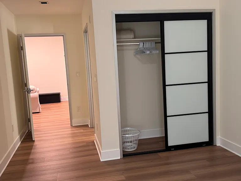 Bedroom 2 closet with view to living area