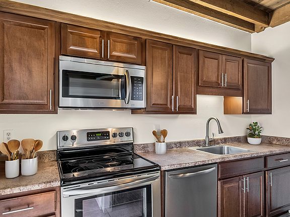 Staged. Not actual unit, but same floor plan, cabinetry and stainless steal appliances.