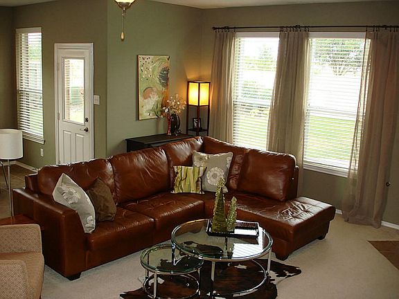 The living room overlooks the large backyard