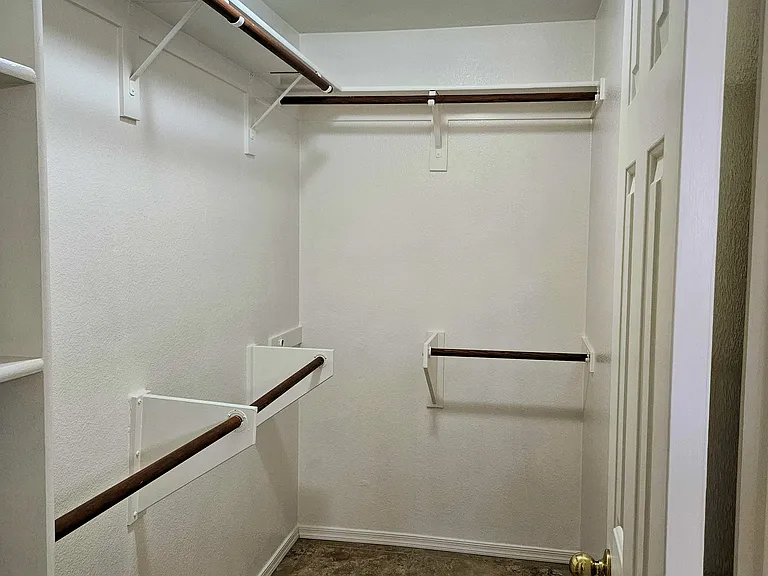 Walk in closet in primary bedroom