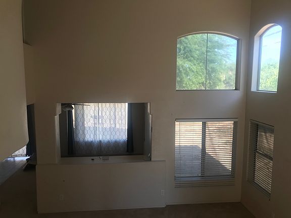 Living room 1 with four large windows.