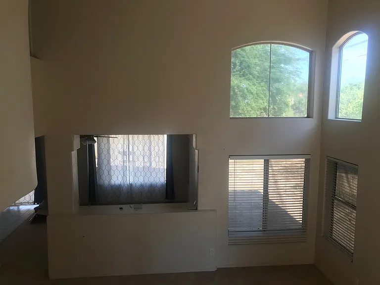 Living room 1 with four large windows.