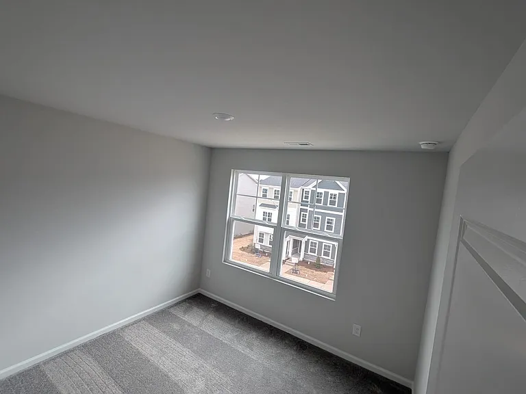 Front view of one of other bedrooms on third floor