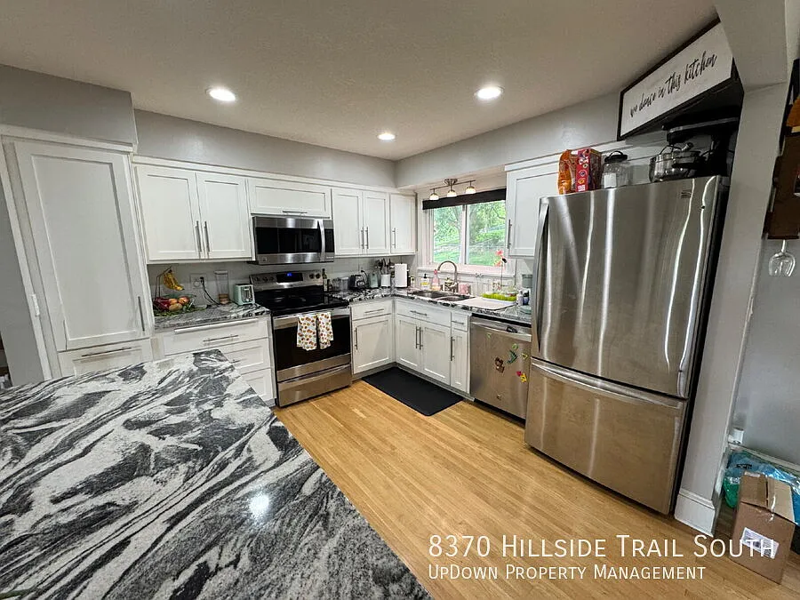 "Experience Elegant Living: 4-Bed Home with Granite Touches & Cozy Fireplace in Cottage Grove!" — Photo 3