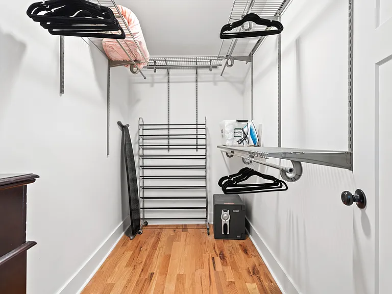 Primary bedroom walk in closet