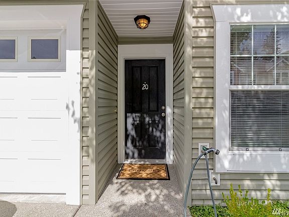 Covered entry and a bonus...water spigot to wash car and water flowers and yard! This is not always found in condos that include the water in the HOA!