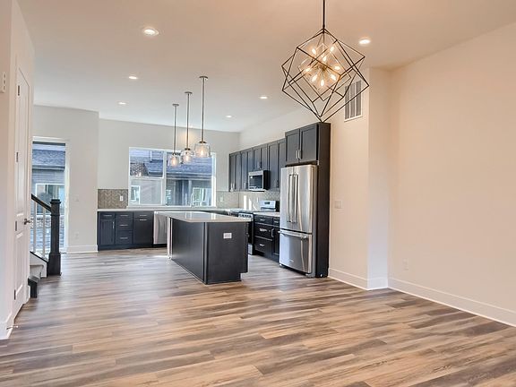 View of dining room and kitchen from living room