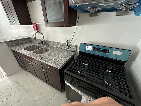 New Range, hood and kitchen Cabinets.