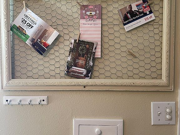 Just inside the front door. Mailbox retrieval