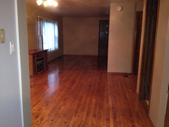 Living room/dining room. Great hardwood floors. Electric fireplace included.