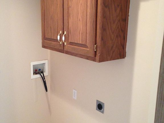 Separate laundry room off kitchen