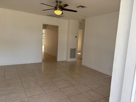 Living Room towards Kitchen & Hallway